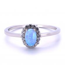 Stříbrný prsten s modrým opálem a zirkony